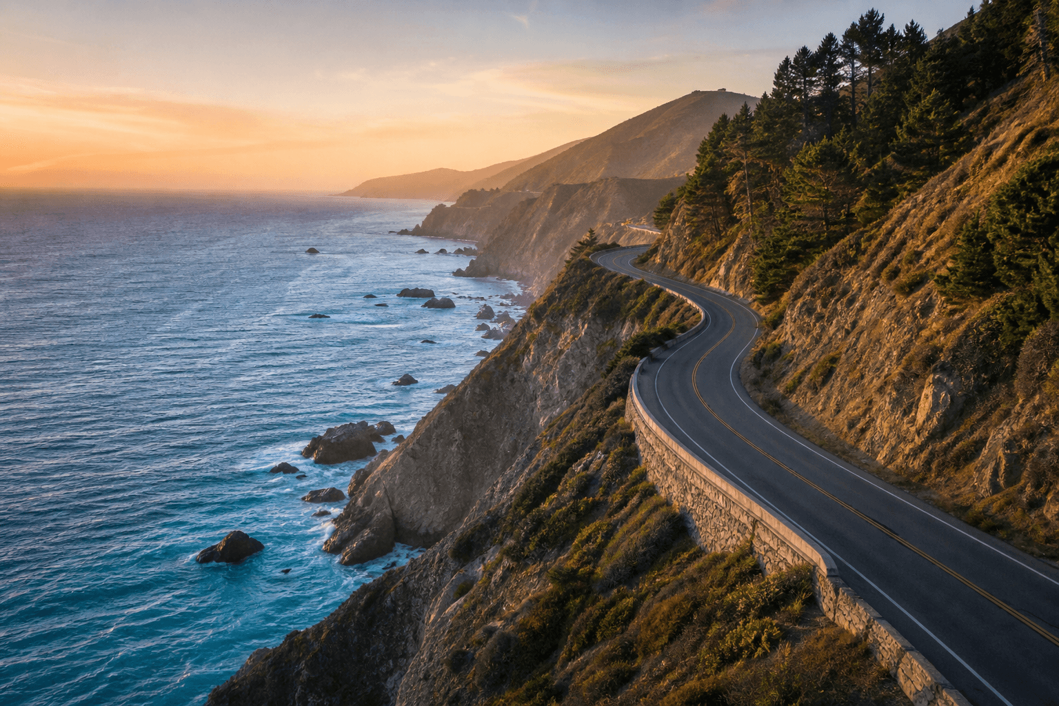 Pacific Coast Highway along ocean cliffs at golden hour
